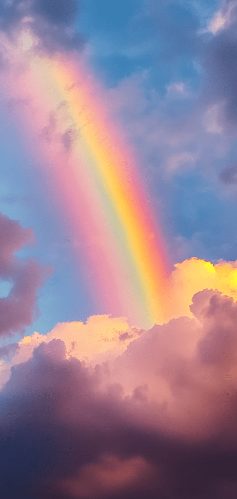 Vibrant rainbow over pastel clouds