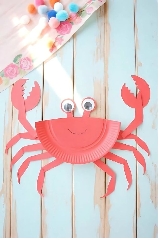 Red paper plate crab with googly eyes and cut-out claws