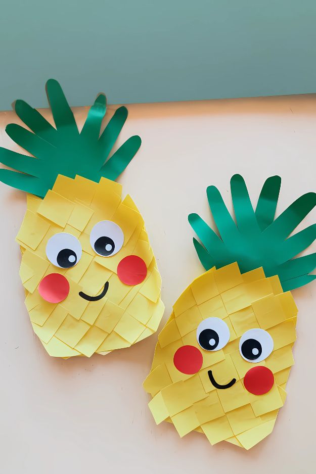 Handprint pineapples with textured yellow square layers and paper faces.