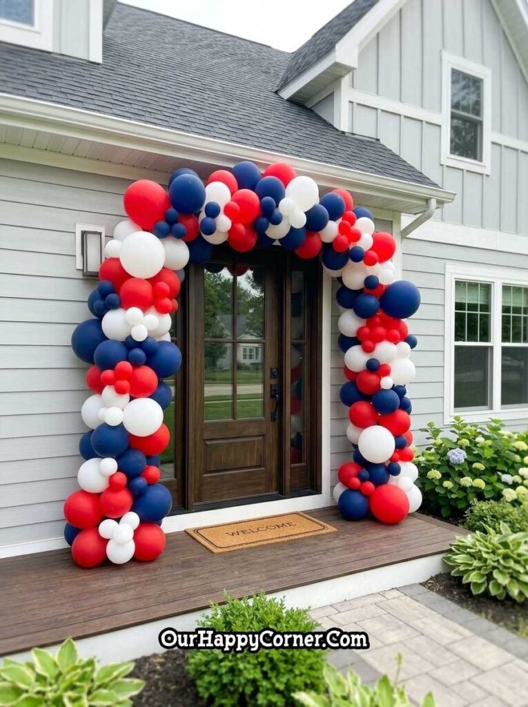 4th of July porch with red white blue balloon arch