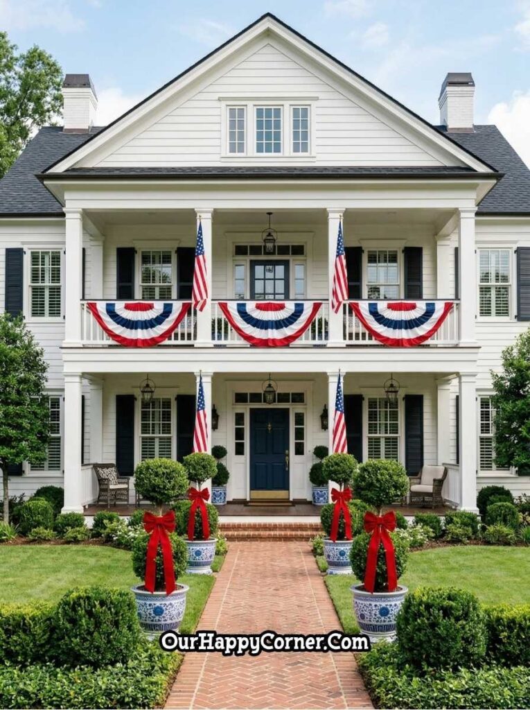 Elegant 4th of July porch with bunting, flags, and symmetrical planters with red bows