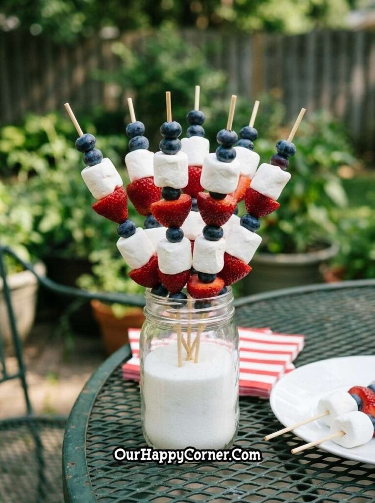 4th of July party food fruit skewers with strawberries marshmallows and blueberries