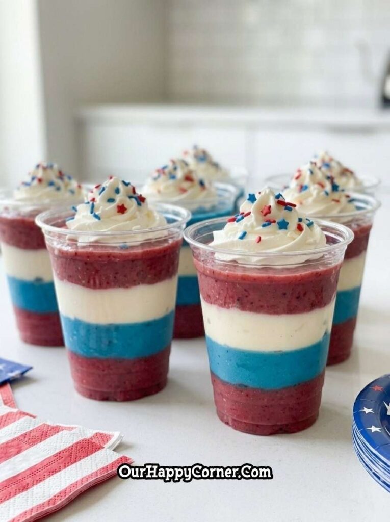 layered smoothie cups with red white and blue layers