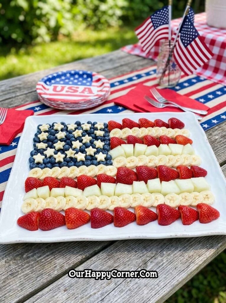 4th of July party food fruit platter arranged like american flag with berries and bananas