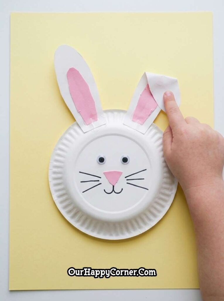 paper plate bunny with one ear bent forward