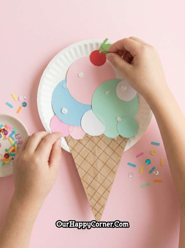 Adding cherry detail to top of the scoops