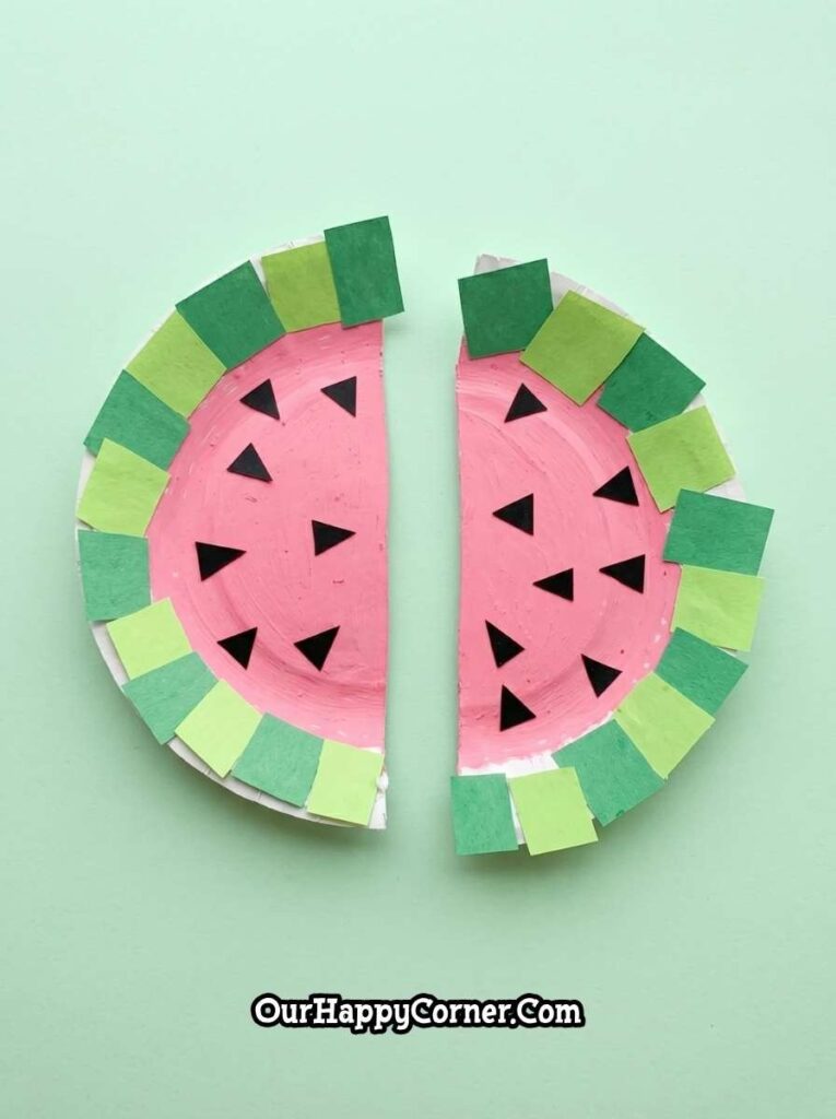 Finished paper plate watermelon craft with seeds and green rind