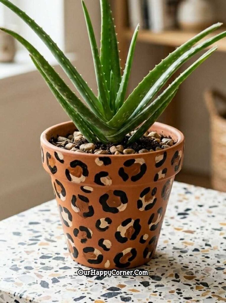 Classic leopard print terracotta pot painting with aloe vera plant