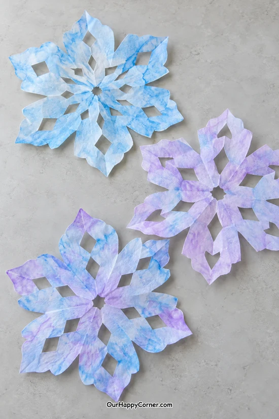 Blue and lavender watercolor coffee filter snowflakes