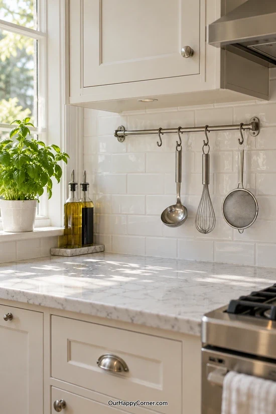 Cooking tools hanging from a kitchen wall rail