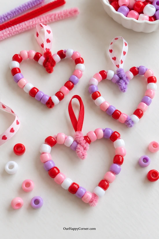 Pony-bead heart decorations in pink red purple and white